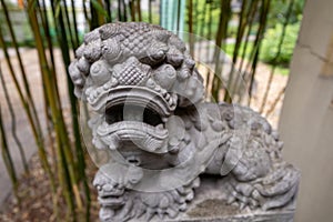 Japanese garden. Gate, statue, plants, Buddha, garden.