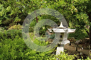 A Japanese garden with a stone lantern, Maple tree, shrubs, ferns at Rotary Botanic Gardens in Janesville, Wisconsin