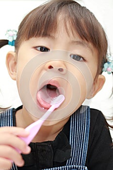 Japanese girl brushing her teeth