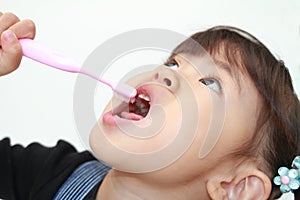 Japanese girl brushing her teeth