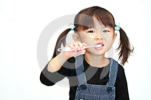 Japanese girl brushing her teeth
