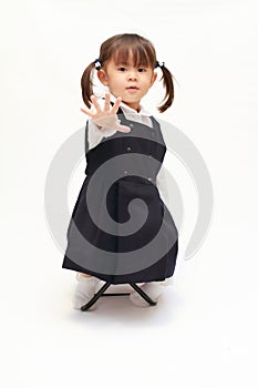 Japanese girl on the chair in formal wear