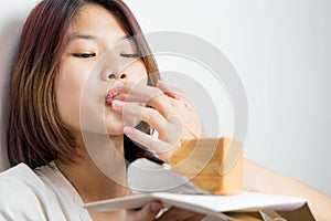Japanese girl is deeply enjoying by lick the cake