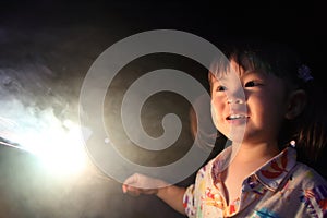 Japanese girl doing handheld fireworks