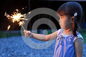 Japanese girl doing handheld fireworks