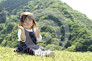 Japanese girl eating rice cracker