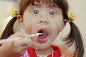 Japanese girl eating shaved ice in Yukata