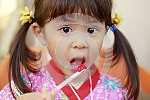 Japanese girl eating shaved ice in Yukata