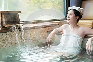 Japanese girl enjoy the hot springs water