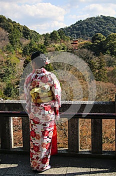 Japanese girl in kimono dress at Kiyomizu-dera Buddhist Temple in Kyoto, Japan