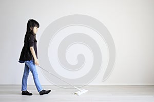 Japanese girl mopping the floor