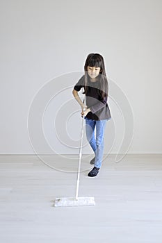 Japanese girl mopping the floor