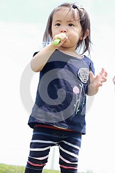 Japanese girl playing with bubble