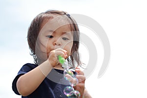 Japanese girl playing with bubble