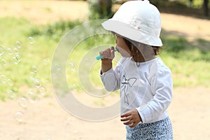 Japanese girl playing with bubble