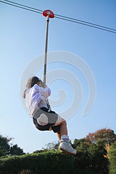 Japanese girl playing with flying fox