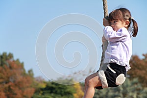 Japanese girl playing with flying fox