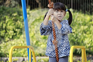 Japanese girl playing with flying fox