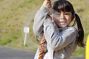 Japanese girl playing with flying fox