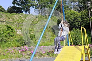 Japanese girl playing with flying fox