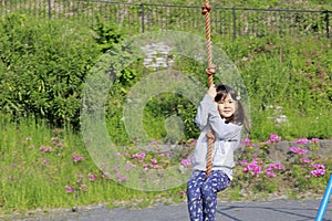 Japanese girl playing with flying fox