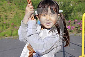 Japanese girl playing with flying fox