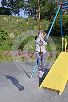 Japanese girl playing with flying fox