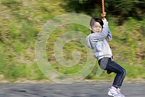Japanese girl playing with flying fox