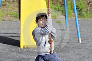 Japanese girl playing with flying fox