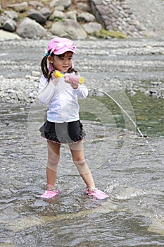 Japanese girl playing in the river