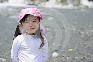 Japanese girl playing in the river