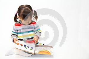 Japanese girl reading a picture book