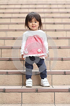Japanese girl standing on the stairs