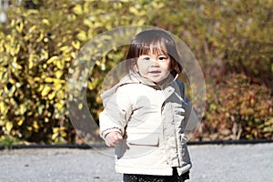 Japanese girl taking a walk in the park