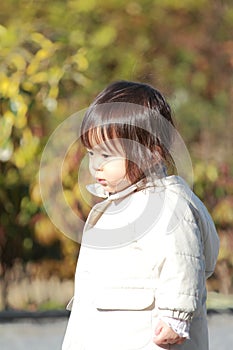 Japanese girl taking a walk in the park