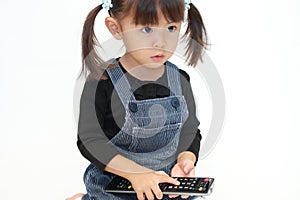 Japanese girl using remote controller