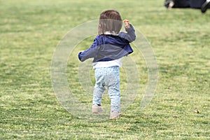 Japanese girl walking on the grass