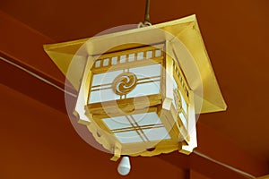 Japanese golden lantern hanging at the Kanda Myojin Shrine in Tokyo, Japan