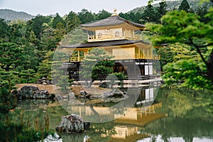 Japanese golden temple located in pond in Kyoto