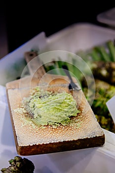 Japanese grated fresh Wasabi on traditional shark skin wooden gr