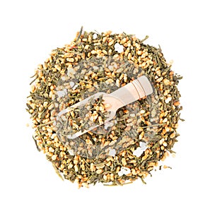 Japanese green tea Genmaicha, isolated on white background. Tea leaves with roasted brown rice. Organic tea. Top view. Close up