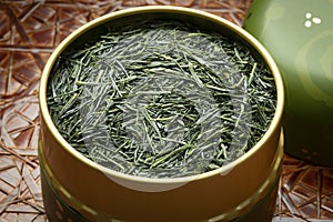 Japanese Gyokuro dried tea leaves close up in a tea tin