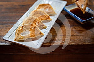 Japanese gyoza served in plate with delicious soy sauce dip