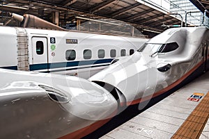 Japanese high speed Shinkansen bullet train waiting on a platform in Osaka station