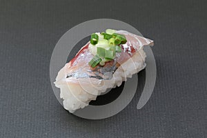 Japanese horse mackerel sushi on black background