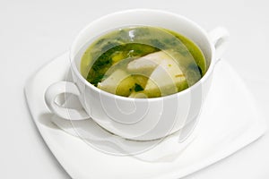 Japanese hot miso soup in a white bowl on a saucer with a napkin