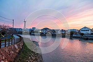 Japanese houses by Matsuura river with twilight sky at dusk, Saga