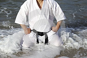 Japanese karate martial arts training at the beach