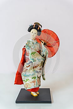 Japanese kimono doll or Hina Ningyo in a red kimono