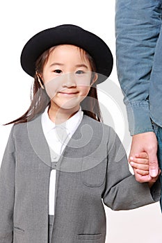 Japanese kindergartener walking to kindergarten wi